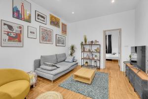 Televízia a/alebo spoločenská miestnosť v ubytovaní Le Clos Dupont - Appartement avec jardin et terrasse à Toulouse