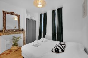 Posteľ alebo postele v izbe v ubytovaní Le Clos Dupont - Appartement avec jardin et terrasse à Toulouse