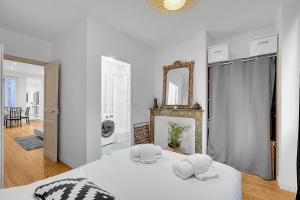 Posteľ alebo postele v izbe v ubytovaní Le Clos Dupont - Appartement avec jardin et terrasse à Toulouse