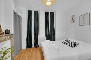 Posteľ alebo postele v izbe v ubytovaní Le Clos Dupont - Appartement avec jardin et terrasse à Toulouse