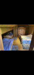 two bunk beds in a room with at Drulenu sodyba 