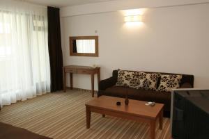a living room with a couch and a table at Villa Valeev in Sozopol