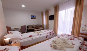 Letto o letti in una camera di Apartmani Rvović