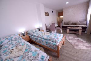 Letto o letti in una camera di Apartmani Rvović