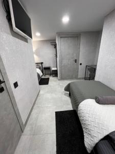 a room with two beds and a television in it at Avto Spa in Khmelʼnytsʼkyy