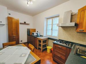 a kitchen with a stove and a counter top at La finestra sui Cappuccini in Turin