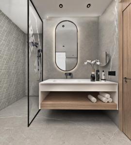 a bathroom with a sink and a mirror at Crowne Plaza Sofia, an IHG Hotel in Sofia