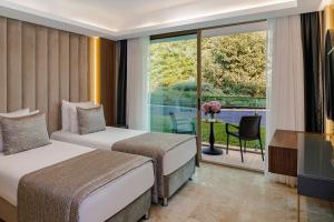 Postel nebo postele na pokoji v ubytování Vogue Hotel Supreme Bodrum