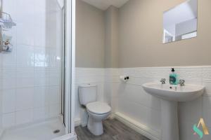 a bathroom with a toilet and a sink and a shower at Thornaby House TSAC in Thornaby on Tees