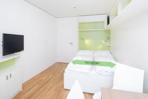 TV i/ili multimedijalni sistem u objektu myNext - Hotel Leo