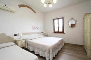 Posteľ alebo postele v izbe v ubytovaní Agriturismo San Martino
