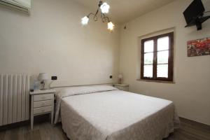 Posteľ alebo postele v izbe v ubytovaní Agriturismo San Martino