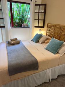 Cama ou camas em um quarto em Pousada Paloma