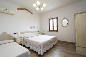 Posteľ alebo postele v izbe v ubytovaní Agriturismo San Martino
