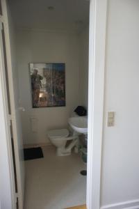 a bathroom with a toilet and a sink at Kongensgade (ID 161) in Esbjerg