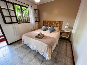 Cama ou camas em um quarto em Pousada Paloma