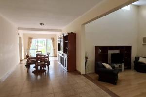a living room with a table and a dining room at Casa quinta en la ruta 1 km 3.5 in Santa Fe