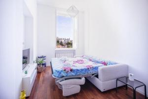 a small room with a bed and a window at Belvedere Hambury Apartment by Wonderful Italy in Bordighera +9 photos