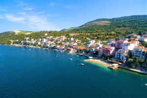 an aerial view of a town on the water at AG Komarna - Peljesac Bridge Apartments in Komarna +22 photos