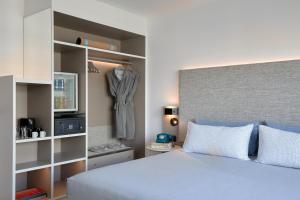 Postel nebo postele na pokoji v ubytování INNSiDE by Meliá Barcelona Apolo