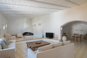 a living room with a couch and a table at El Porró in Cadaqués