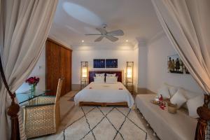 Postel nebo postele na pokoji v ubytování Riad Dar Justo Hotel Boutique & Spa + 37 fotografií