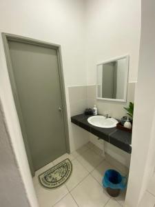 a bathroom with a sink and a mirror at The Vista Apartment @ Demak Laut in Kuching