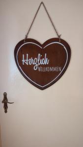 a sign that reads kruitzkrit willorenemen hanging on a wall at Landhaus "Kühler Morgen", Komfortable 65 qm FeWo mit gehobener Ausstattung, Garten, baby- und kindgerecht in Saalburg