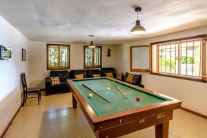 a living room with a pool table in it at Catalunya Casas Nature and Tranquility for 24 pax - 30km to beach in Sant Pere de Vilamajor