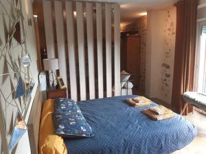 Ένα ή περισσότερα κρεβάτια σε δωμάτιο στο Les Pierres Blondes +33 φωτογραφίες