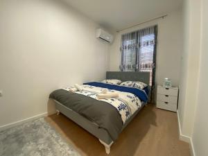 a bedroom with a bed and a window at Apartman EN in Trebinje +14 photos