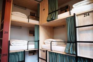 a room with several bunk beds in it at The Bee Hostel in Amsterdam