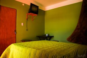 מיטה או מיטות בחדר ב-Alto Independencia