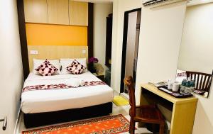 Postel nebo postele na pokoji v ubytování City Central Hotel