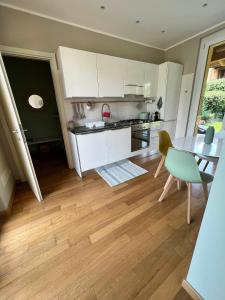 a kitchen with a table and a dining room at Il Canneto in Lomnago