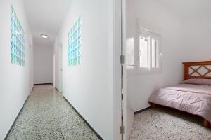 Łóżko lub łóżka w pokoju w obiekcie Casa Mela
