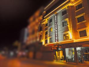 a building with a sign on the side of it at Ceylan Hotel in Bursa