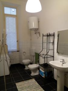 a bathroom with two toilets and a sink and a mirror at Residenza dell'Orto in Chiavari +21 photos