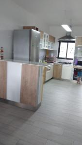 a kitchen with stainless steel appliances in a room at Bungalow at Pereybere in Grand-Baie