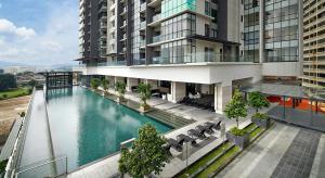 an overhead view of a building with a swimming pool at Element Signature Suites 5pax 3Br Ampang KLCC in Kuala Lumpur