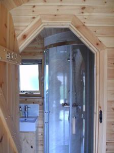 a bathroom with a shower and a sink at Cosy Cabins at Westfield Farm in Yarmouth