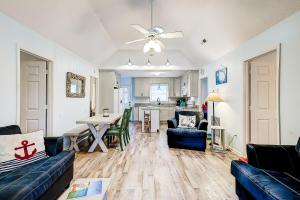 a living room with a couch and a table at Geechee Girl in Edisto Beach