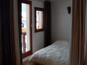 Appartement Valfréjus, 2 pièces, 4 personnes - FR-1-265-247にあるベッド