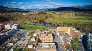 an aerial view of a city with buildings and a river at Hotel O Guerreiro in Ponte da Barca