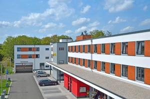 an overhead view of a building with a parking lot at B&B Hotel München City-Ost in Munich