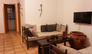 a living room with a couch and a table at Wohnen im orientalischen Ambiente in Harthausen
