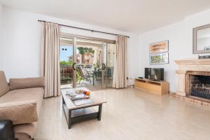 Televízia a/alebo spoločenská miestnosť v ubytovaní Seaside House 4, Alcudia Beach