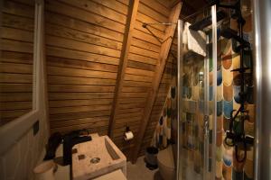 a bathroom with a shower and a sink and a toilet at Byelka Bungalov Ayvalık in Ayvalık