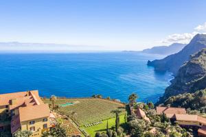 a view of the amalfi coast with a house and the ocean at Hotel Quinta Do Furao in Santana