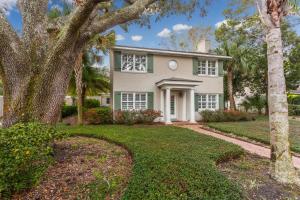 a house with a tree in front of it at Latitude Adjustment - 4311 Ninth Street in Saint Simons Island